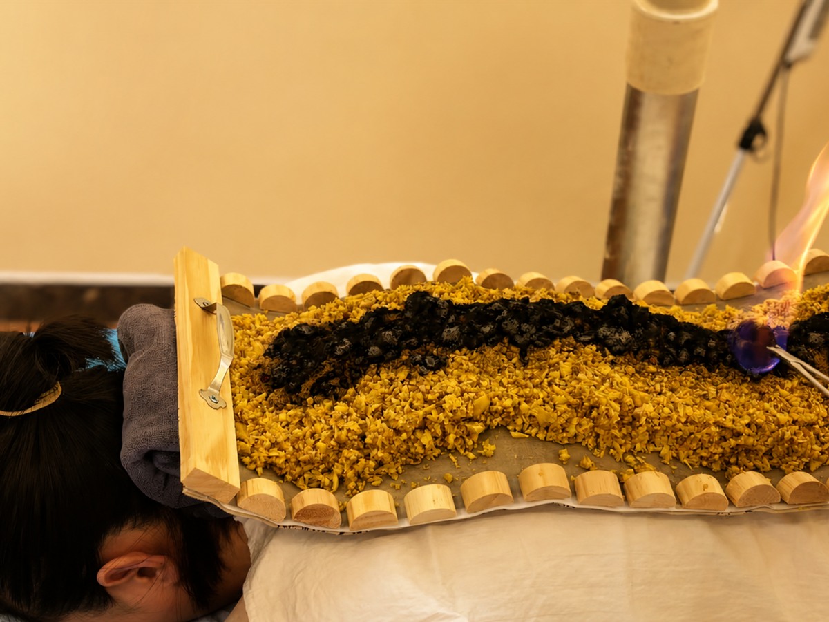 Dumai moxibustion ritual scene with moxa warmth