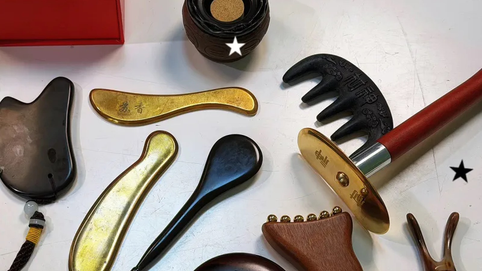 A mixed set of traditional gua sha and bodywork tools for material comparison