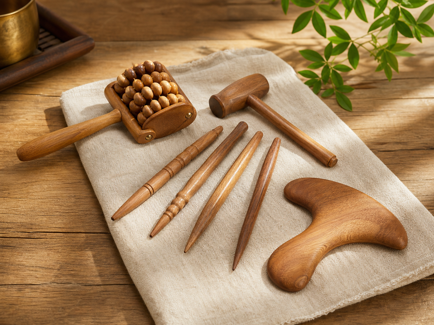 Traditional wooden massage tools and meridian-inspired acupoint sticks on linen and wood