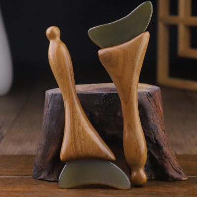 Natural horn eye and face massage stick with wooden handle in a traditional wellness setting