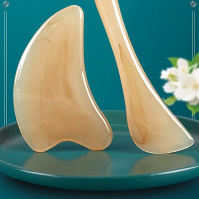Horn-style Gua Sha board and massage stick display