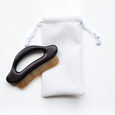 Zitan wood and horn Gua Sha massage board with storage pouch