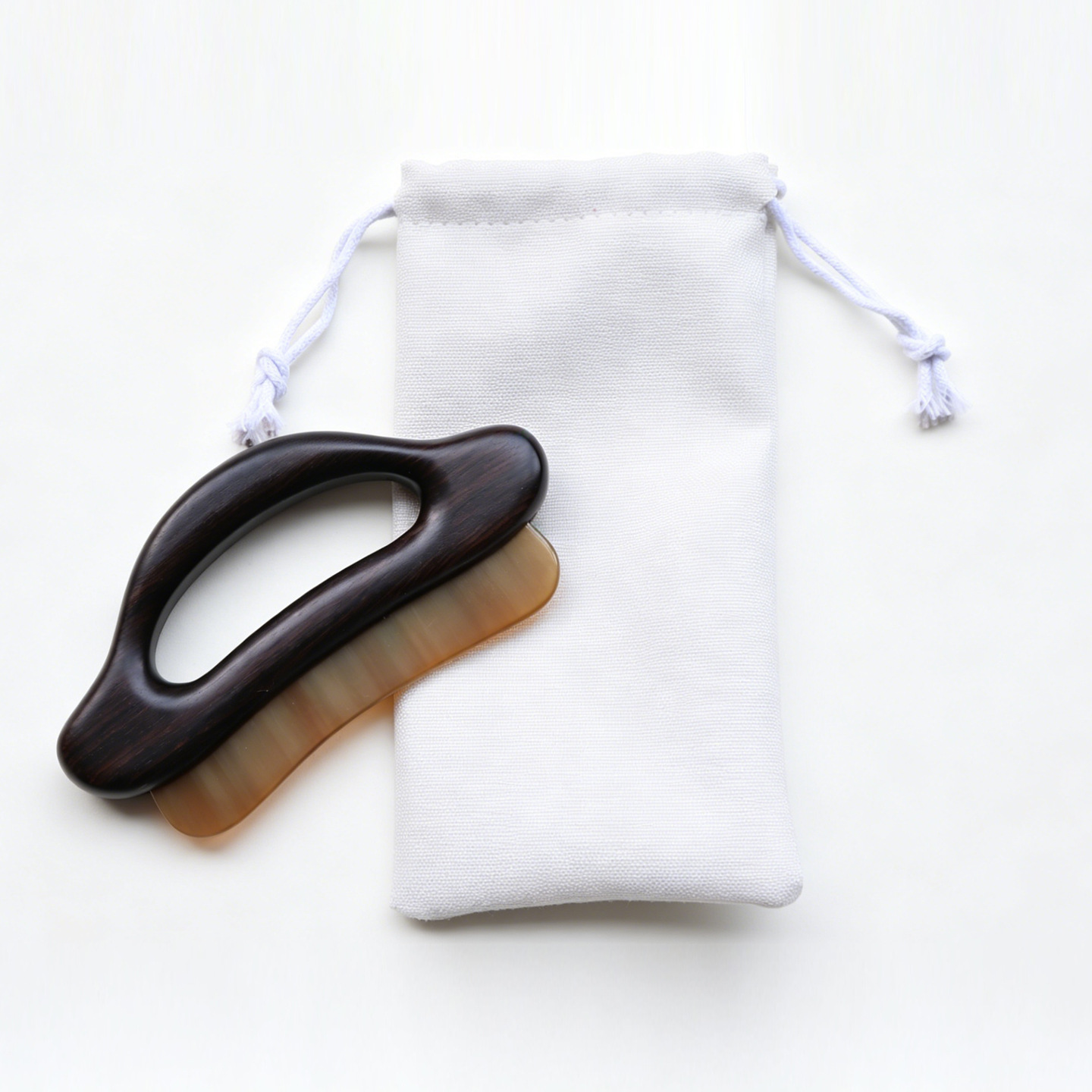 Zitan wood and horn Gua Sha massage board with storage pouch