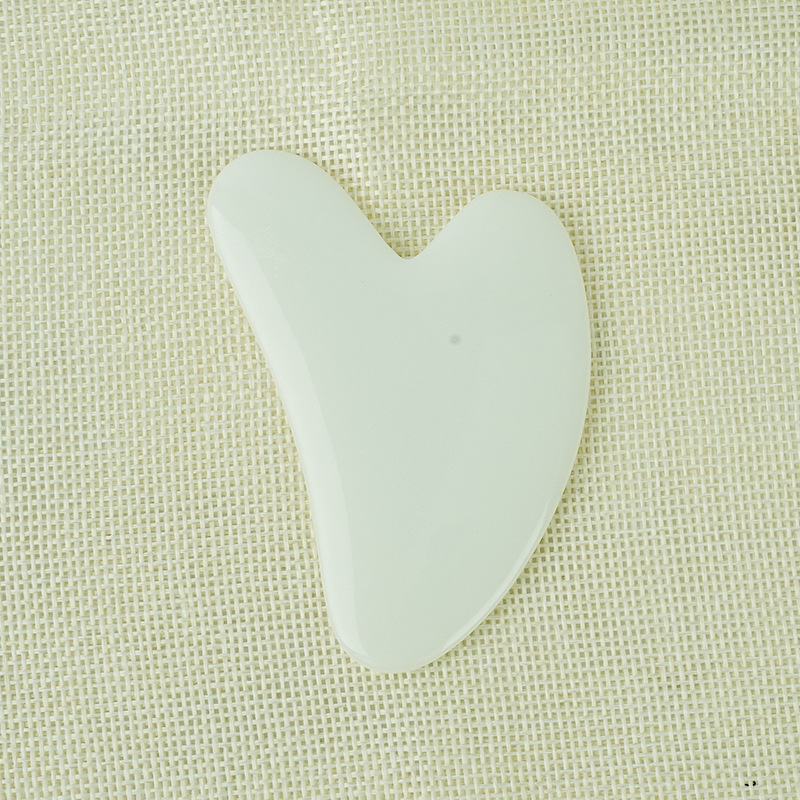 White resin Gua Sha tool